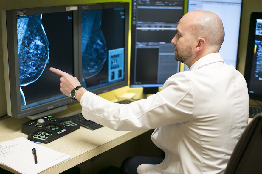 radiologist reviewing 3D Mammogram scan