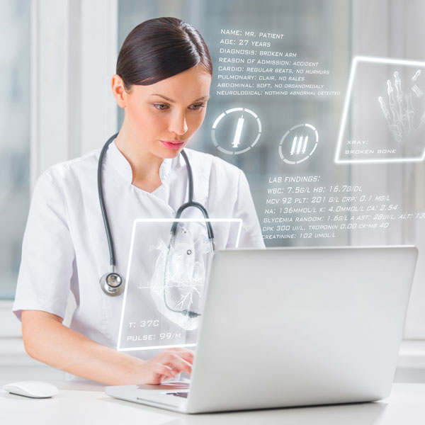 Female doctor using laptop